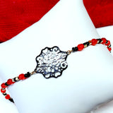 Bracelet fin rouge avec rosace noire