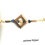 bracelet artisanal moderne de forme géométrique couleur doré et noir