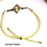 bracelet fait main élégant et moderne avec sa perle centrale géometrique dorée